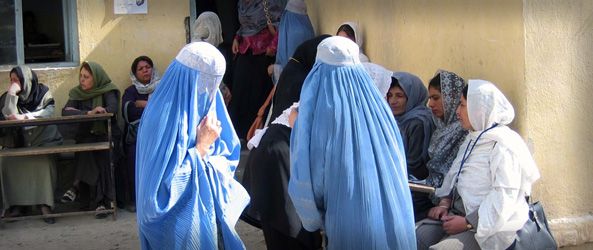 Afghan women line up to vote at a female-only polling station